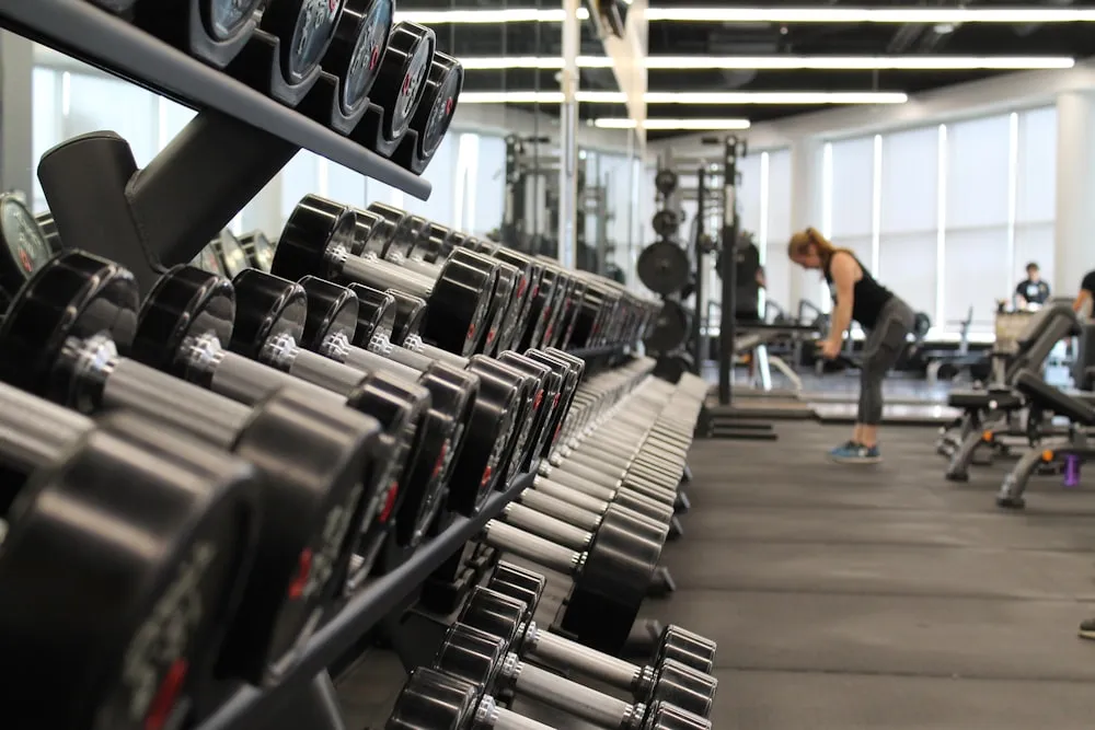 Athlete training with a barbell for strength and hypertrophy